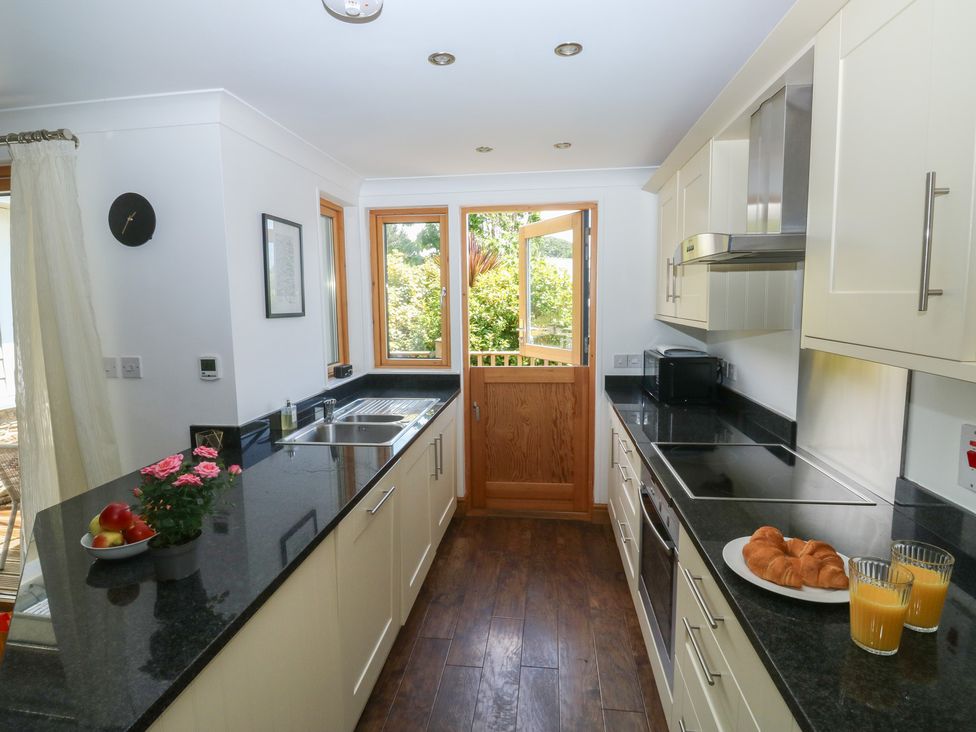 A kitchen with countertop and sink at 2 Court Cottage Dartmoor