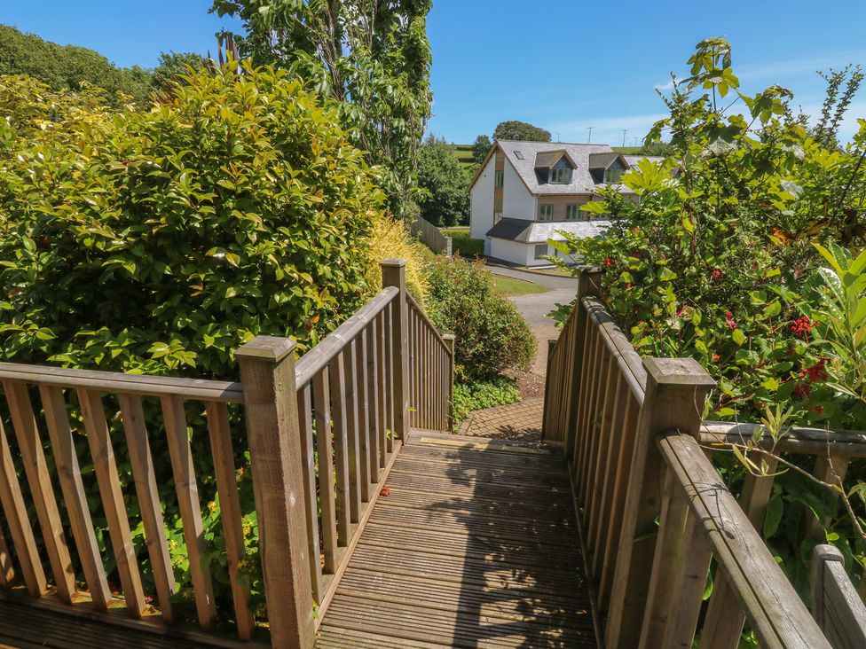 A pathway and stairs leading to a house at 2 Court Cottage in Dartmouth