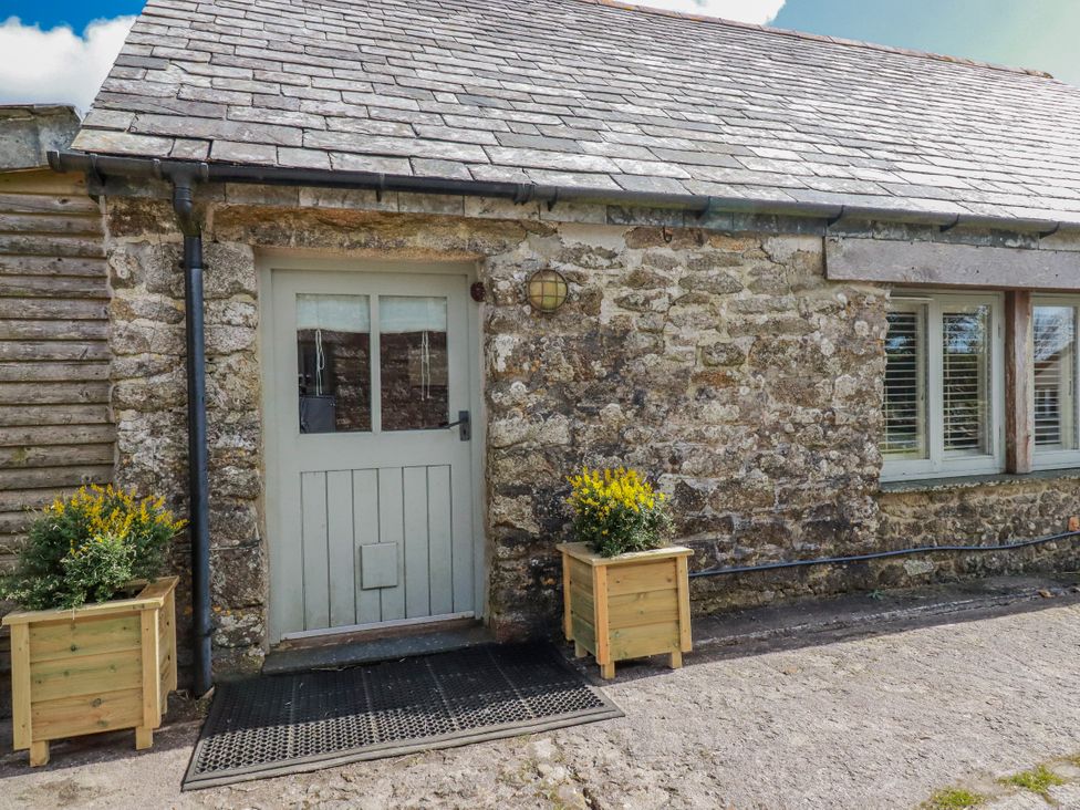 A front entrance with a door and planters at Roughtor Barn Poldue near Camelford
