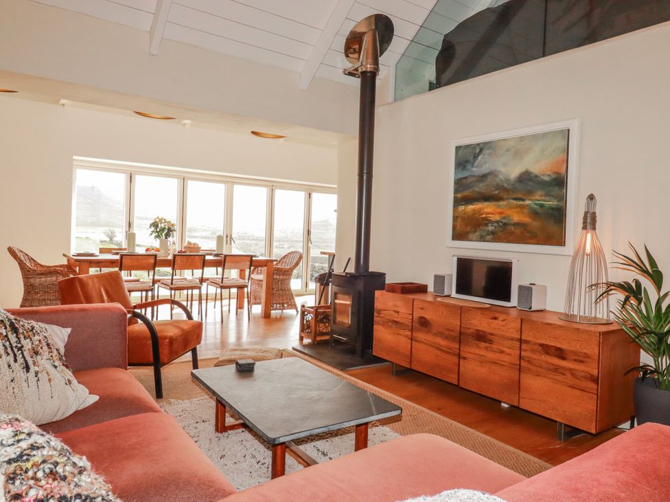 A living room with a sofa and coffee table at Roughtor Barn in Poldue near Camelford