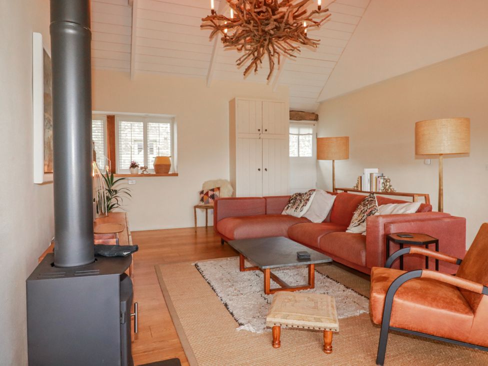 A living room with a sofa and coffee table at Roughtor Barn Poldue near Camelford