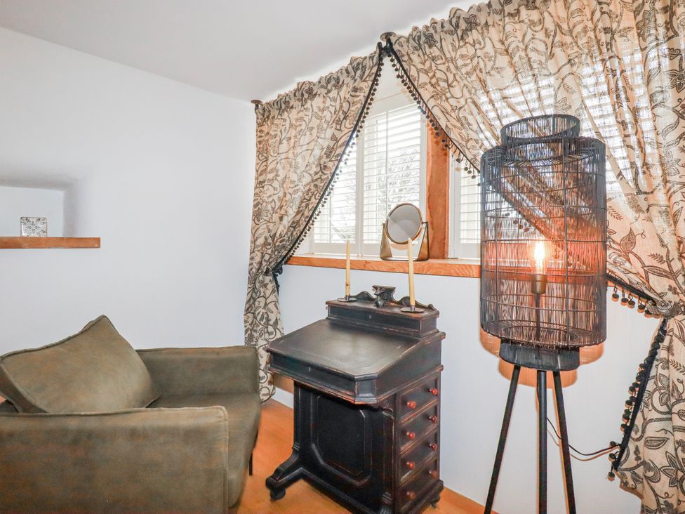 An office with an armchair and a desk at Roughtor Barn Poldue near Camelford