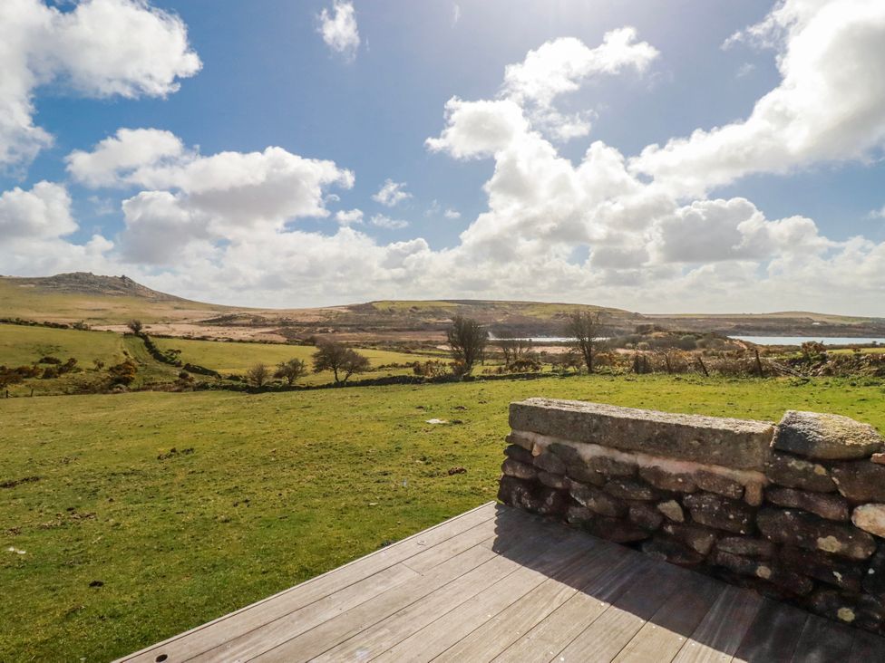 A scenic view of hills and water at Roughtor Barn Poldue near Camelford
