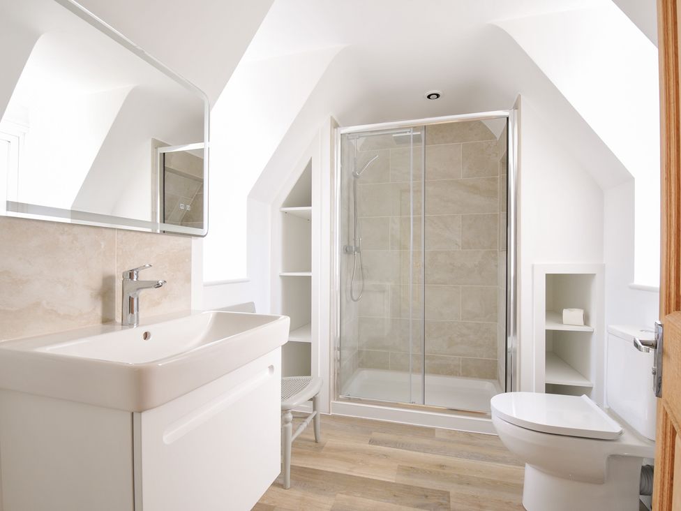 A bathroom with a sink and shower at Seaworthy in Daymer Bay