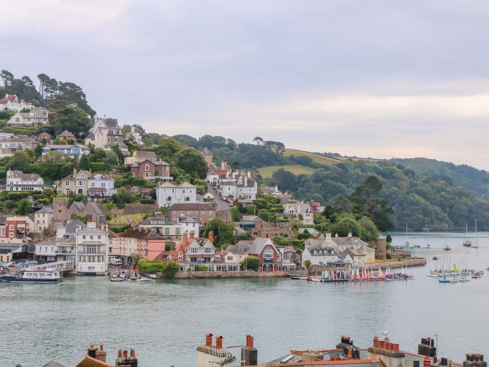 A view of houses and boats by the water at 2 The Old School House 