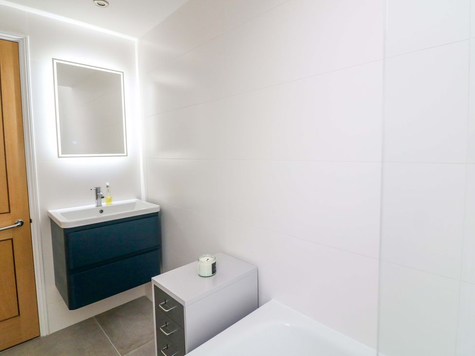 A bathroom with a sink and mirror at 2 The Old School House