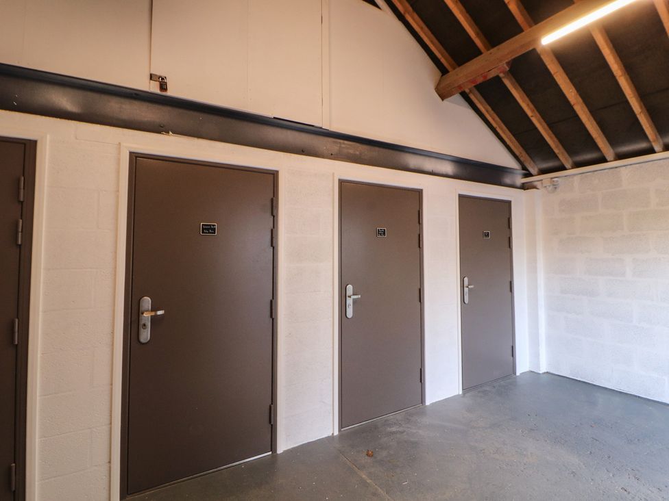 A hallway with multiple doors at Wren's Nest in Thornthwaite near Braithwaite