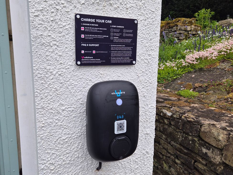 Electric vehicle charging station with instructions at Wren's Nest Thornthwaite near Braithwaite