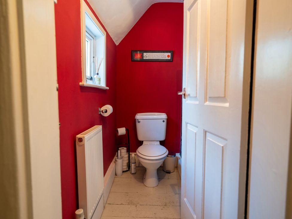 A bathroom with a toilet and sink at 5 St. Michaels Close Framlingham