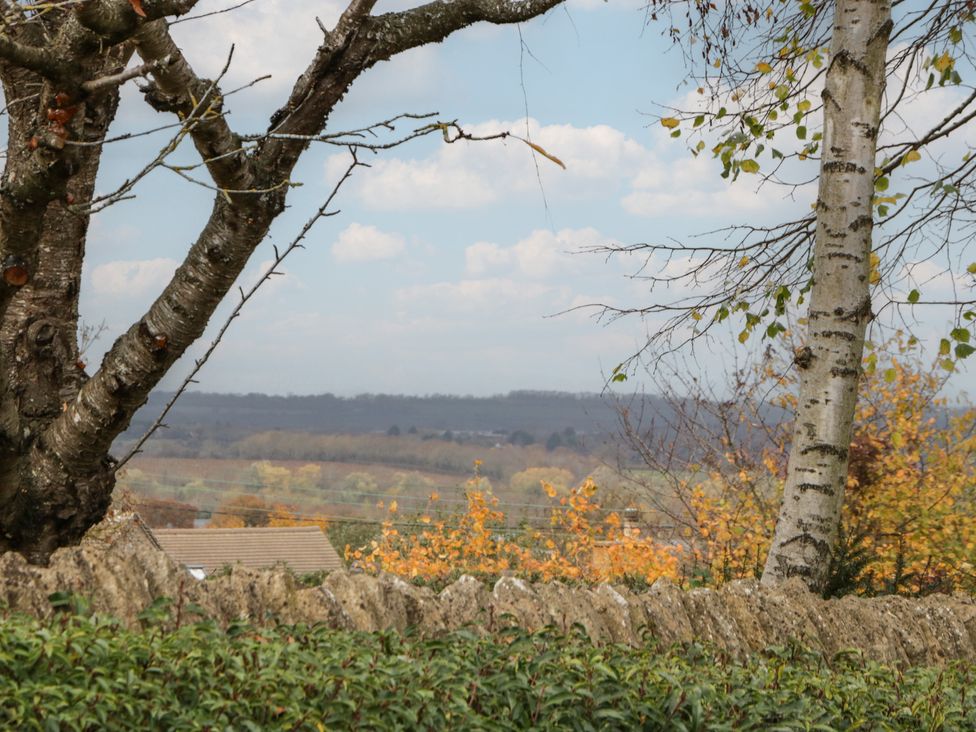A view of trees and landscape at Stable Cottage in Broadway