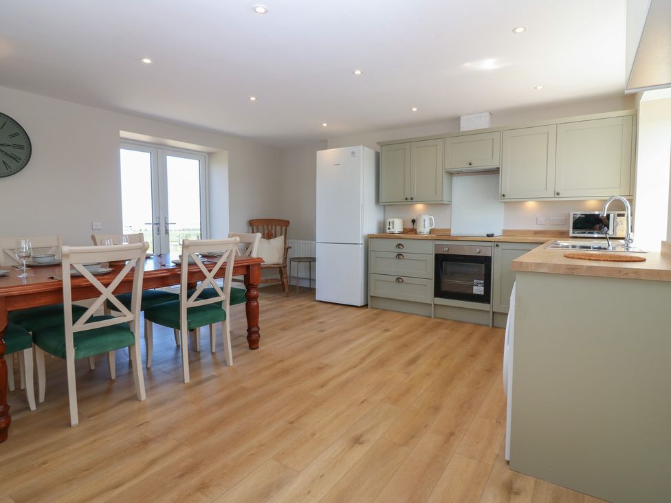 A kitchen with dining table and chairs at No 4 - 3 bed Haddington
