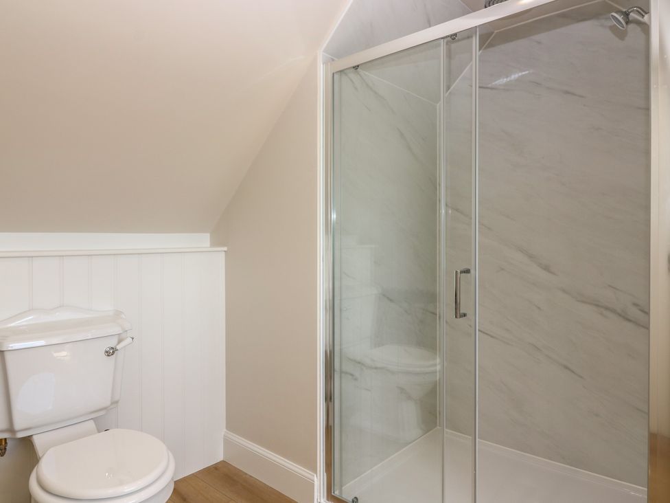 A bathroom with a toilet and a shower at No 4 - 3 bed in Haddington