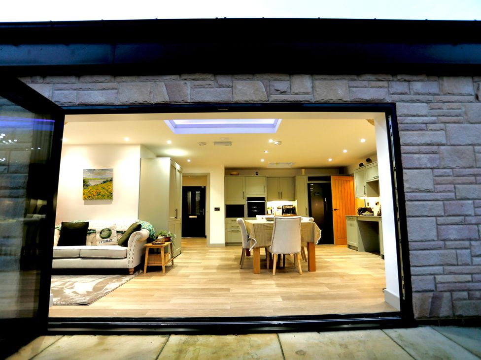 A living room with kitchen units and dining area at Havendale in Chesterfield
