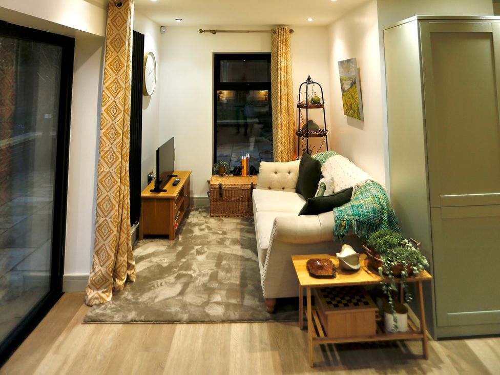 A living room with a sofa and television at Havendale in Chesterfield