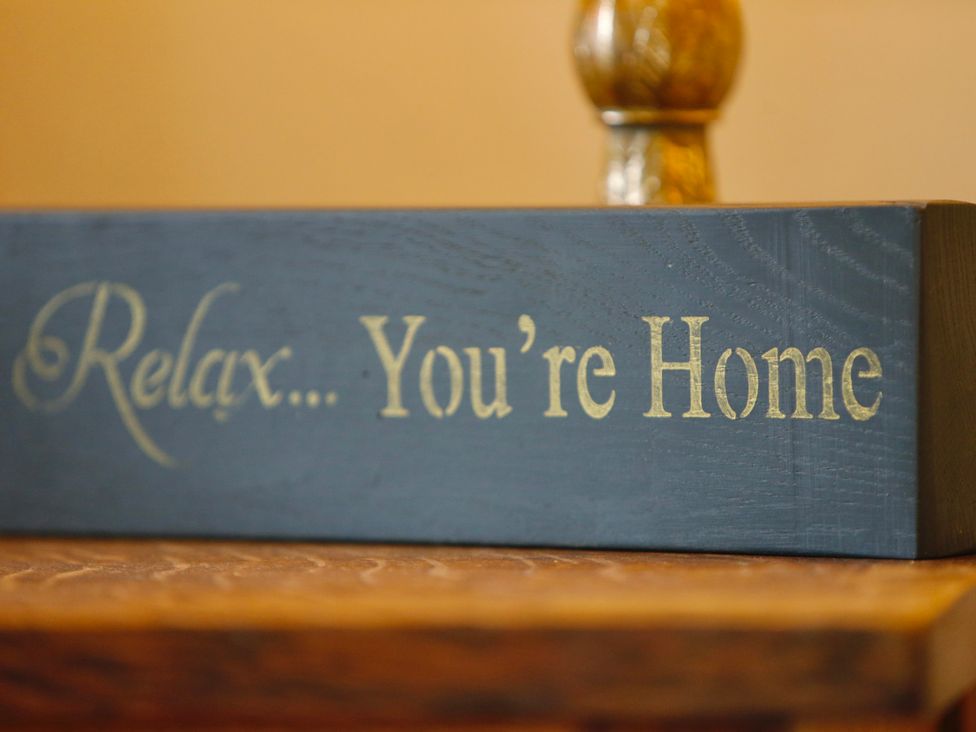 A decorative sign on a table saying Relax... You're Home at Havendale Chesterfield