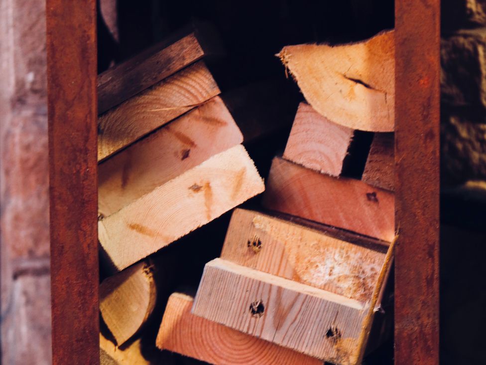 A stack of wooden planks inside a storage area at Havendale, Chesterfield