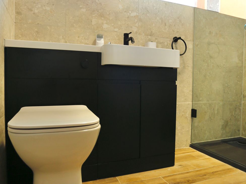 A bathroom with a toilet and sink at Havendale in Chesterfield