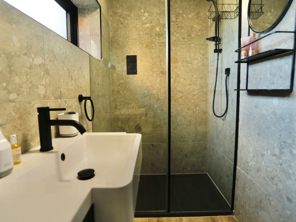 A bathroom with a shower and sink at Havendale in Chesterfield