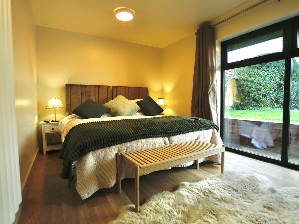 A bedroom with a bed and nightstand at Havendale in Chesterfield