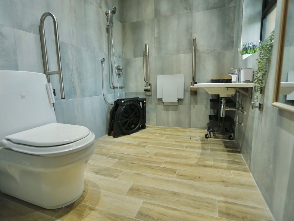 A bathroom with a toilet, shower, and sink at Havendale, Chesterfield