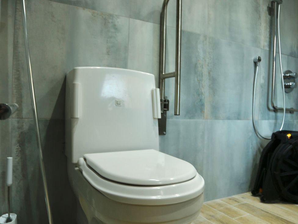 A bathroom with a toilet and shower at Havendale in Chesterfield