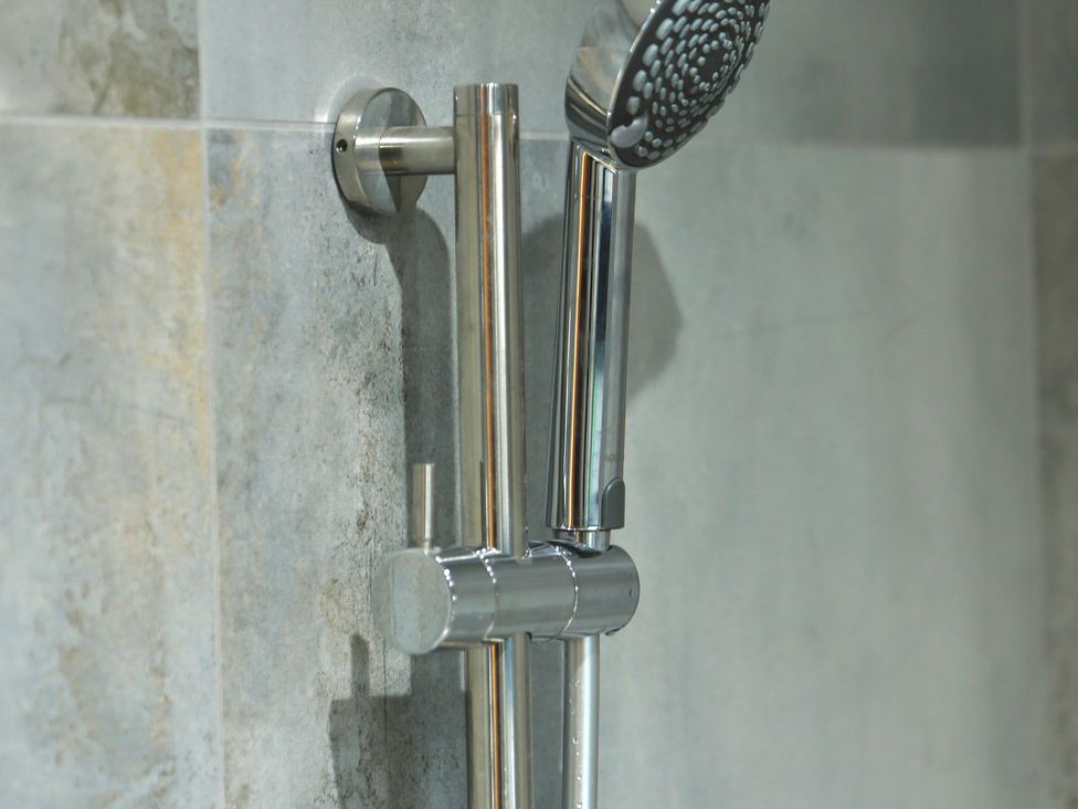 A showerhead and valve in a bathroom at Havendale Chesterfield
