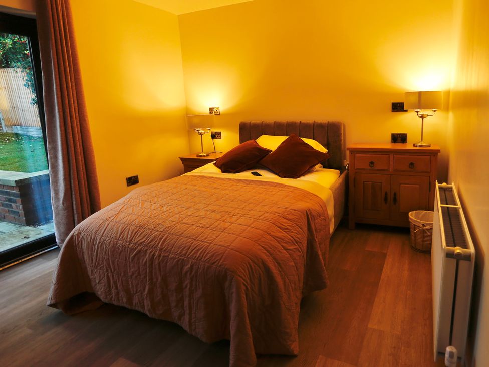 A bedroom with a bed and nightstand at Havendale in Chesterfield