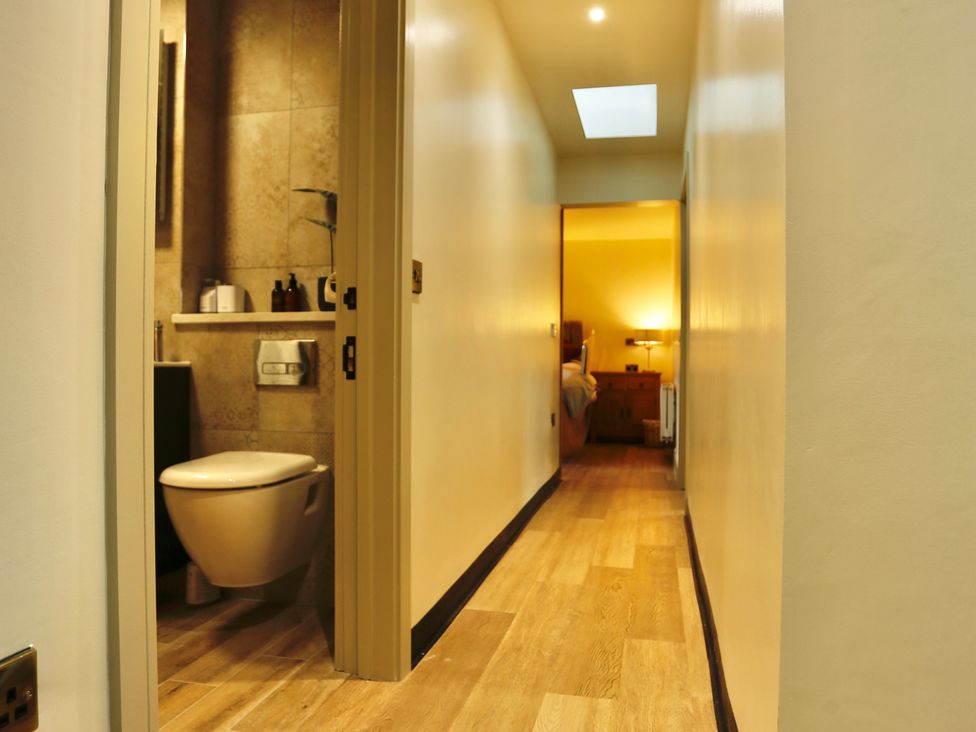 A hallway leading to a bathroom and bedroom at Havendale in Chesterfield