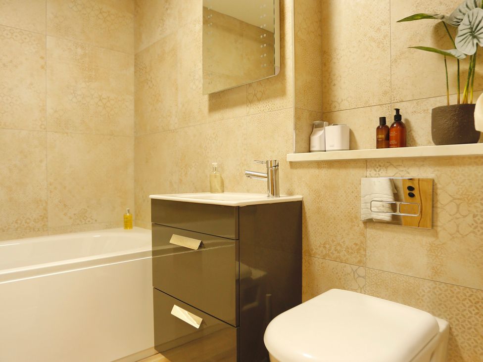 A bathroom with a bathtub and sink at Havendale in Chesterfield