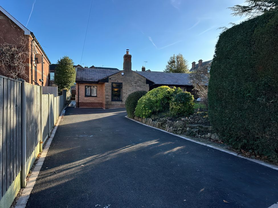 A house with a driveway and greenery at Havendale in Chesterfield