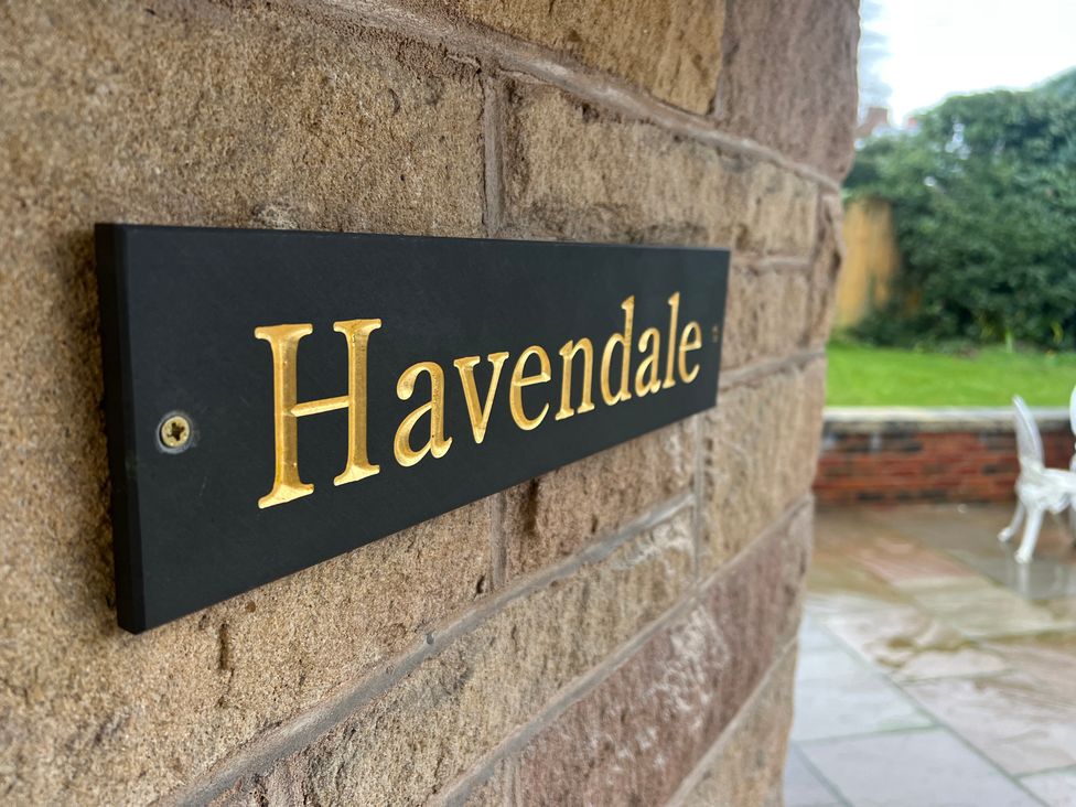 A nameplate reading 'Havendale' on a brick wall at Havendale in Chesterfield