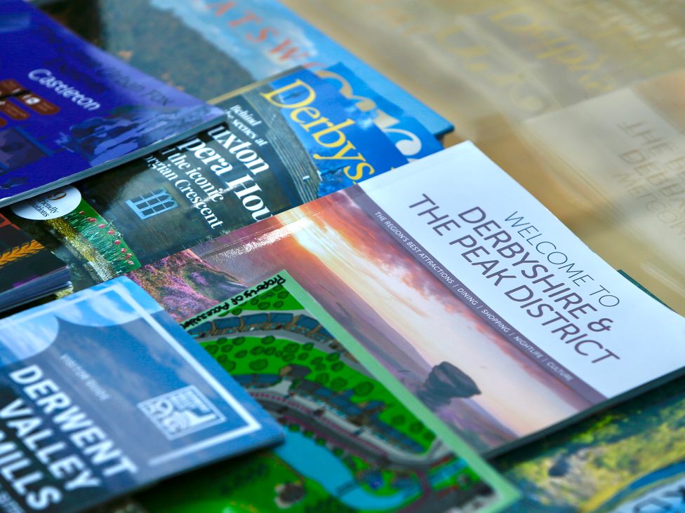 A collection of travel brochures and guides about Derbyshire and the Peak District
