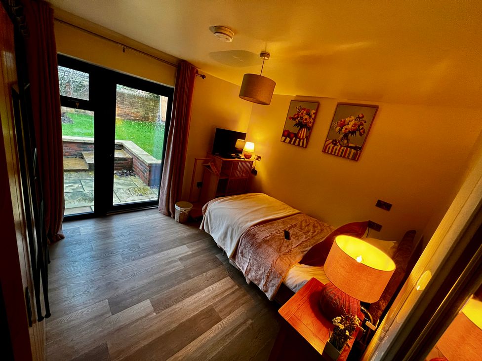 A bedroom with a bed and television at Havendale in Chesterfield