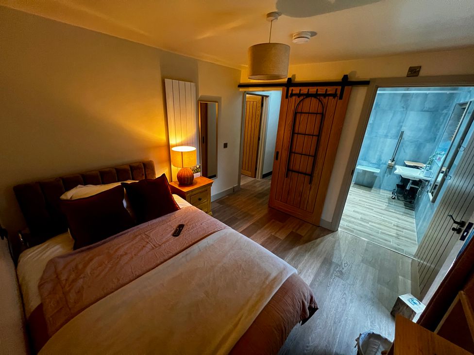 A bedroom with a bed and a connected bathroom at Havendale in Chesterfield