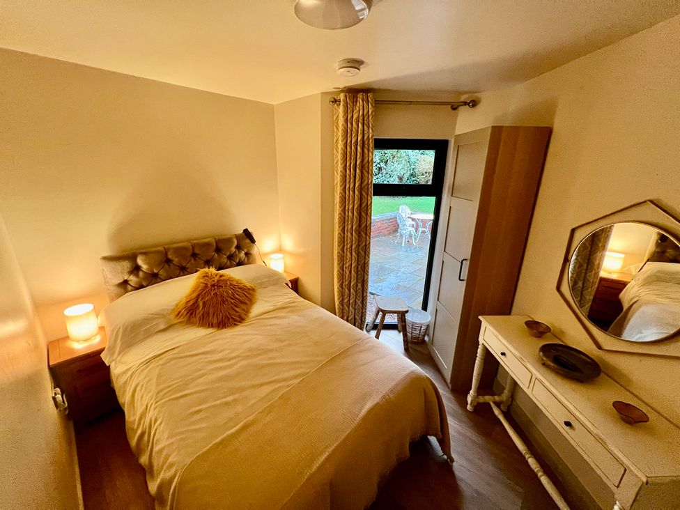 A bedroom with a bed and window facing outdoor at Havendale in Chesterfield