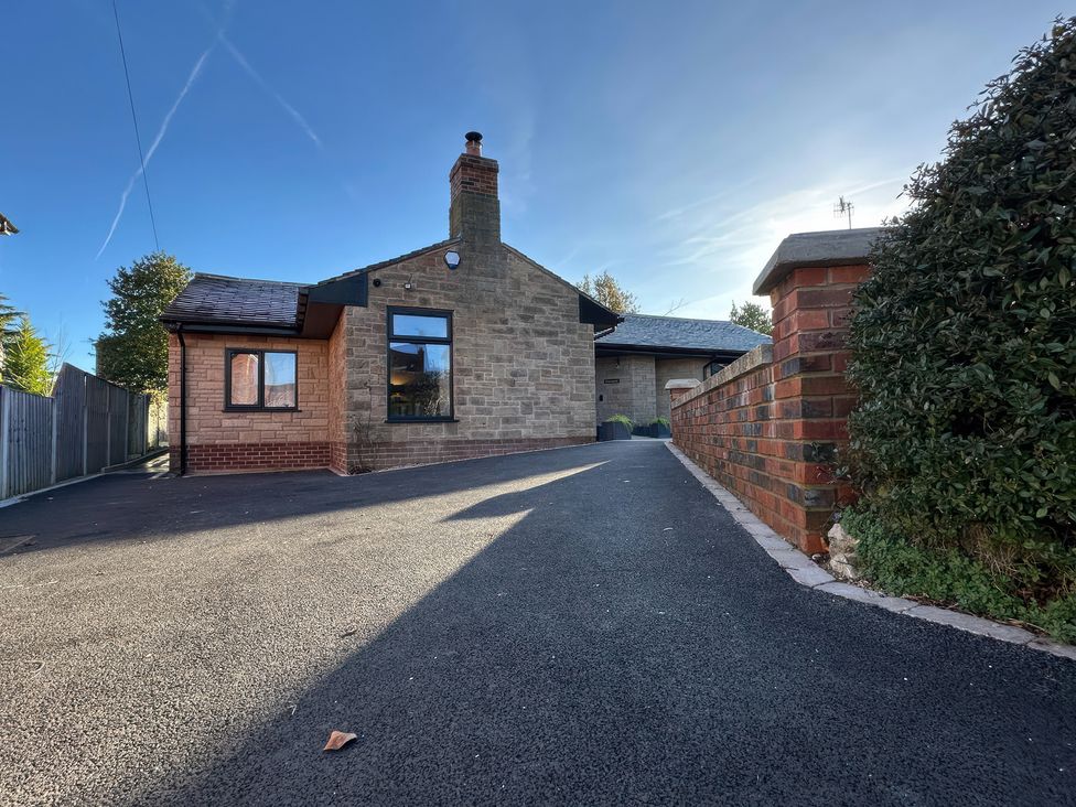 A house with a driveway and garden features at Havendale in Chesterfield