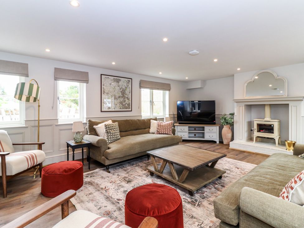 A living room with sofa and coffee table at Tuffs Farm Cottage 2 Kings Langley