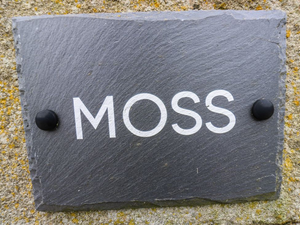 A slate sign with the word MOSS at Moss Cottage in Cragg Vale