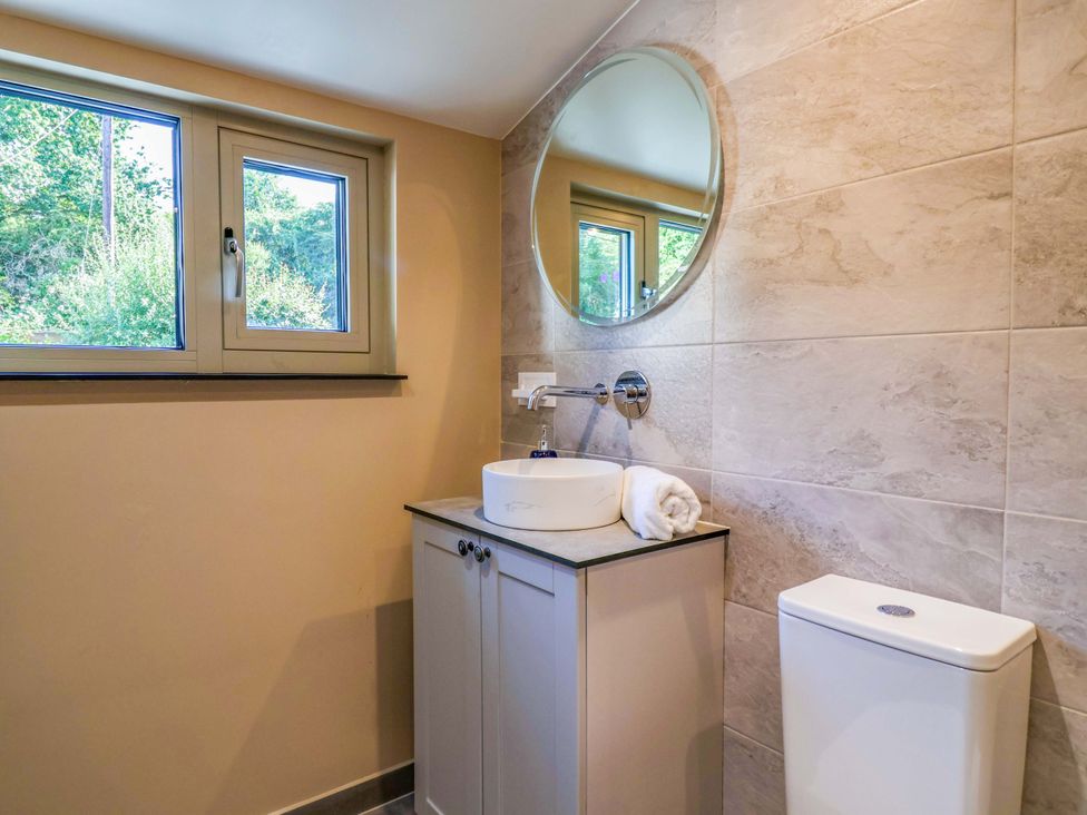 A bathroom with a sink and toilet at Heathmoor in Horrabridge