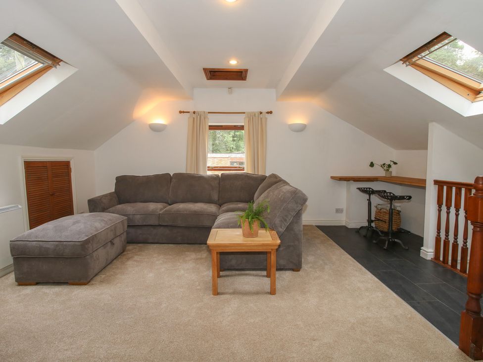 A living room with a sofa and coffee table at Old Forge Apartment Cookley
