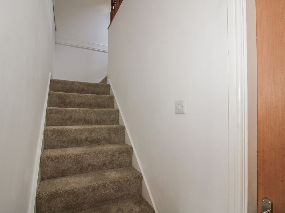A staircase leading to an upper level at Old Forge Apartment Cookley