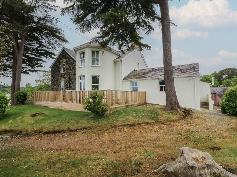 A house with a deck and garden at Fir Grove in Menai Bridge