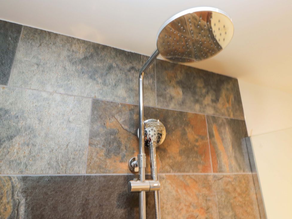 A showerhead installed on the wall at New Barn Conversion Sedbergh