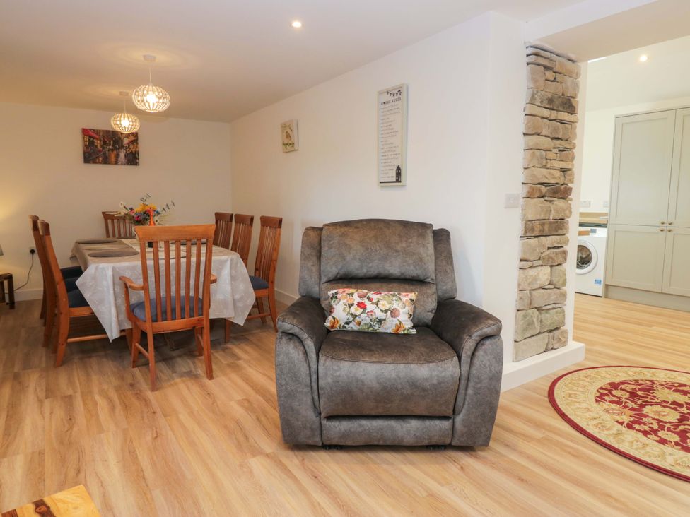 A dining room with a table and chairs at High Birks Barn Cautley near Sedbergh