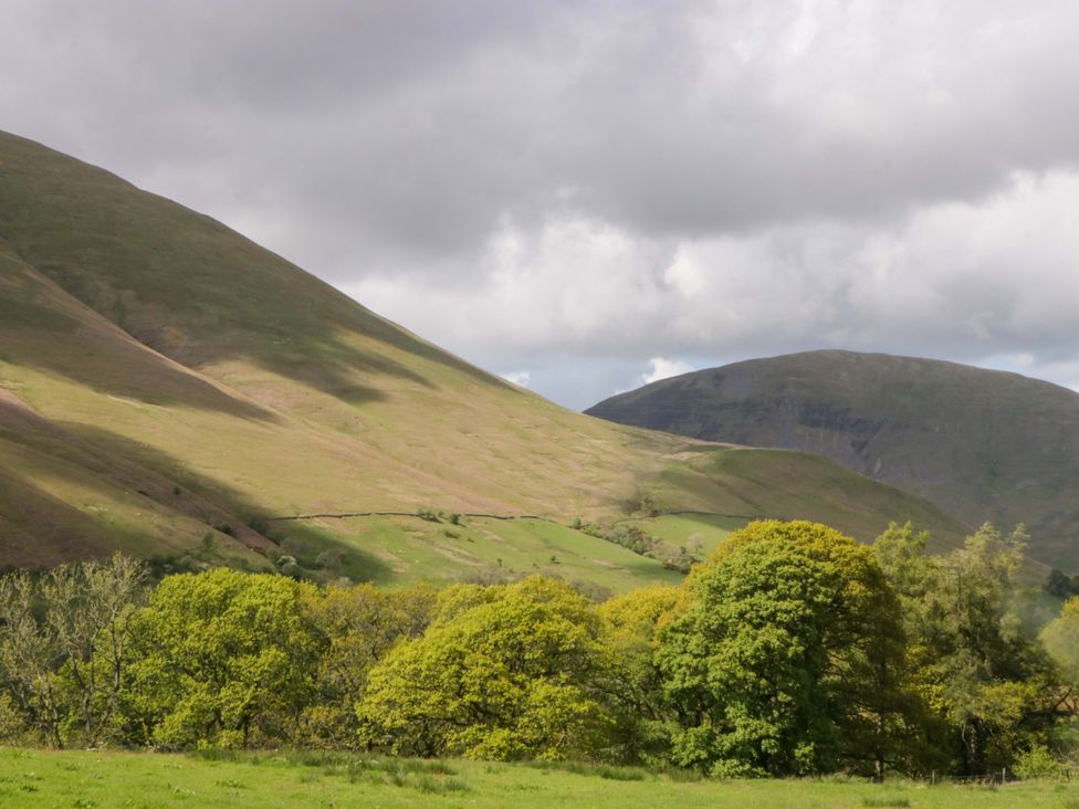 A landscape with hills and trees at High Birks Barn in Cautley near Sedbergh