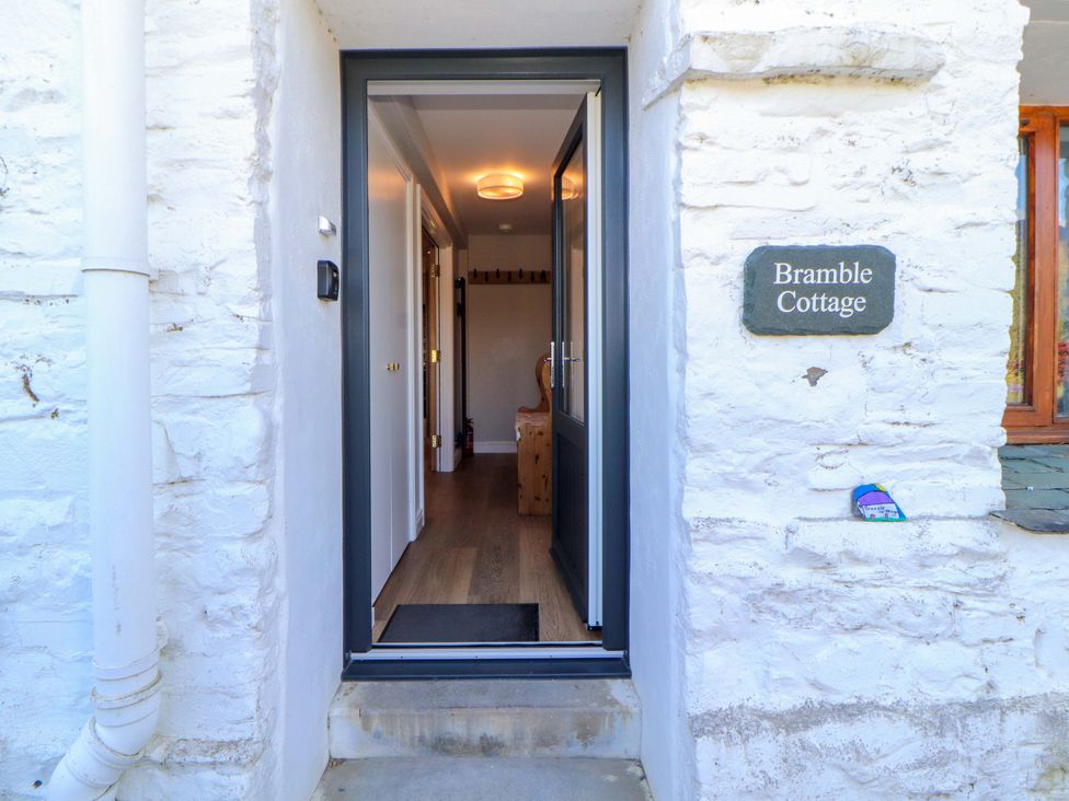 An entrance to Bramble Cottage with door open at Thornthwaite near Braithwaite