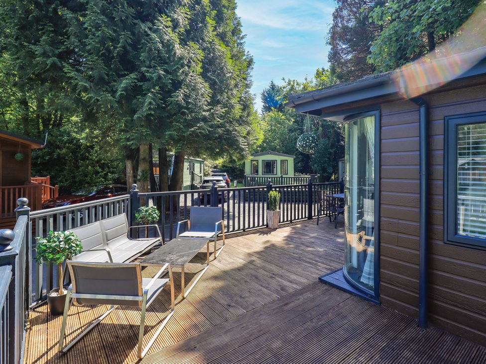 An outdoor area with seating and plants at Evermore Lodge, 48 Calgarth Park, White Cross Bay, Windermere