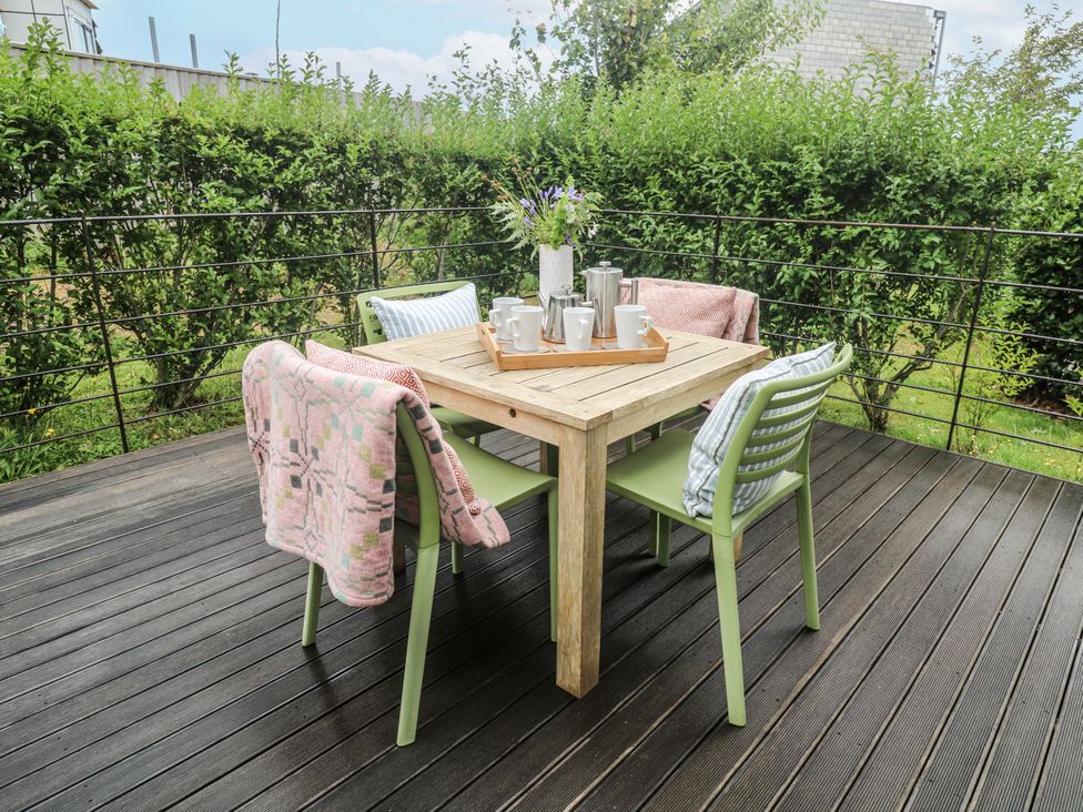 A table with chairs and coffee items at Una, Lodge 70, Carbis Bay