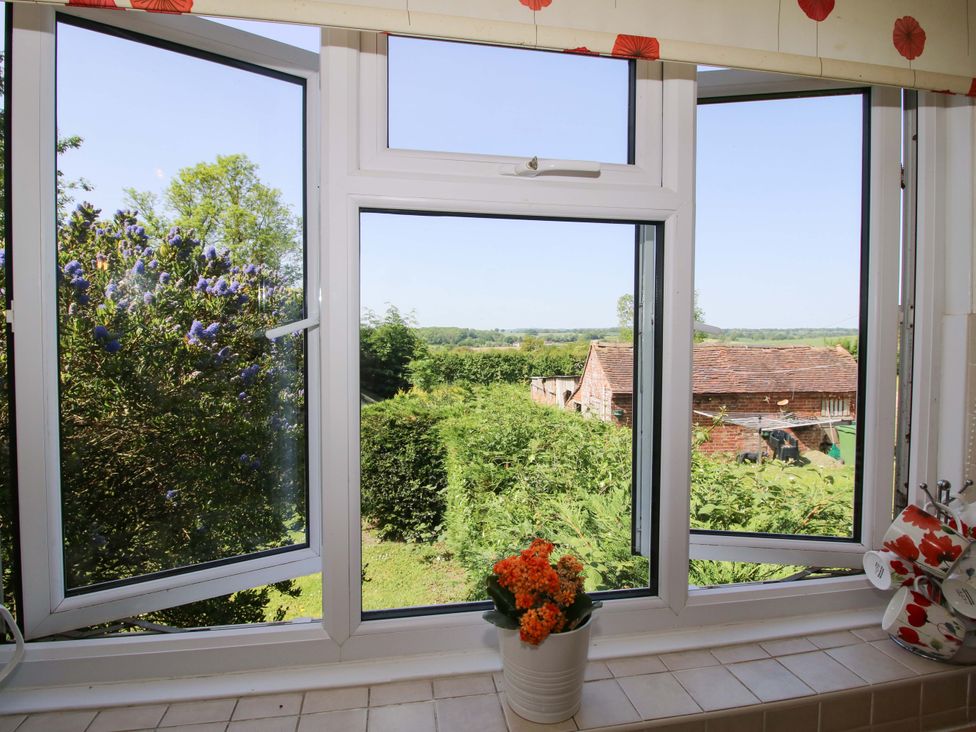 A kitchen window with a view of the garden at Shepherd's Cottage Eudon Burnell near Bridgnorth