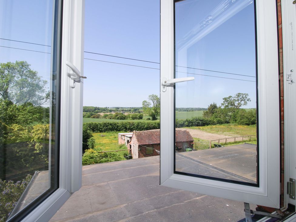 A view from a window showing fields and trees at Shepherd's Cottage Eudon Burnell near Bridgnorth